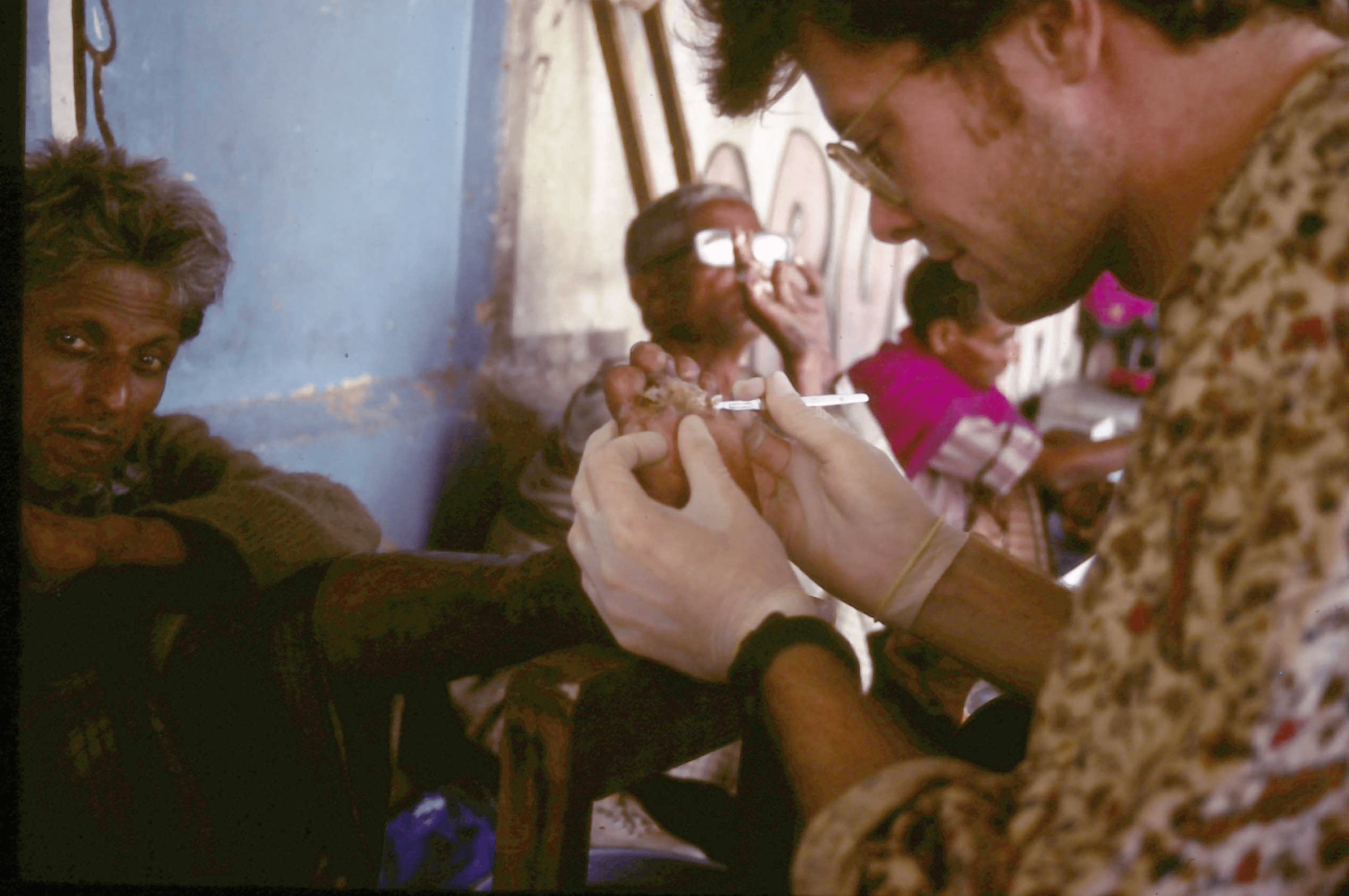 Bob Longworth treating Leprosy patients on a street clinic in Kolkata, 1996