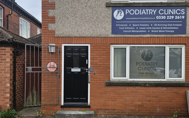 Front entrance of the Leeds Podiatry Clinics practice on Weetwood Grange Grove, with Podiatry Clinics signage above the window