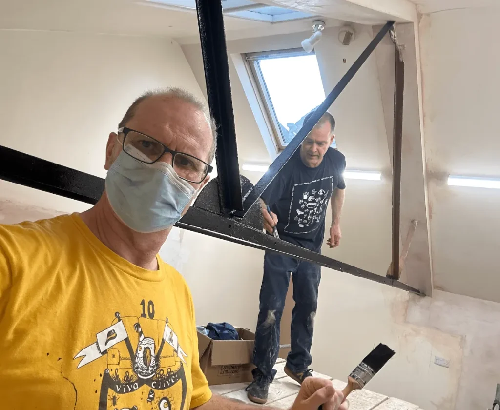 Friends helping with decorating during the refurbishment of the new Leeds clinic